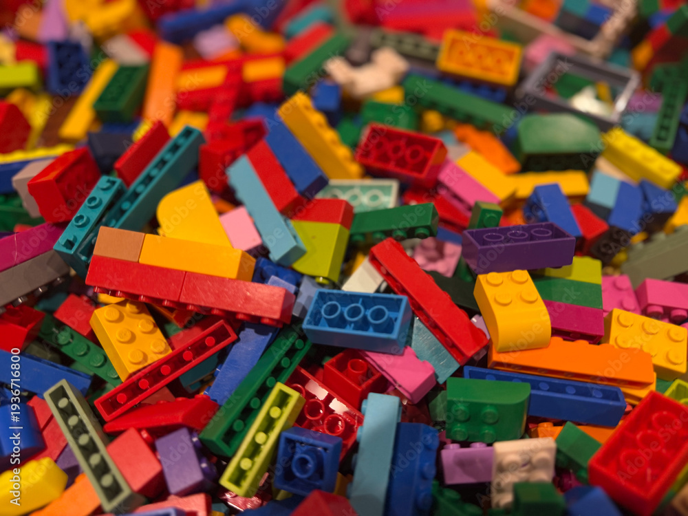 Fototapeta premium Colorful pile of interlocking building bricks