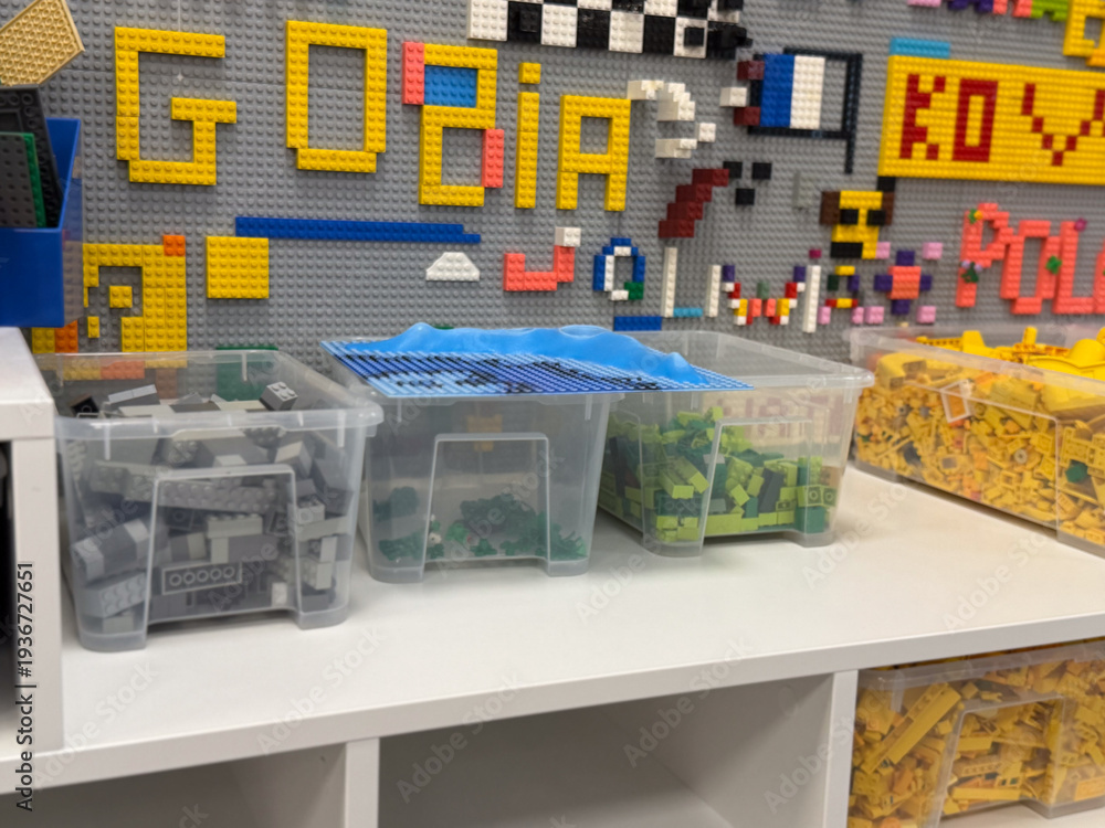 Fototapeta premium Organized lego storage bins on shelf