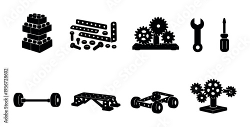 Partially illuminated construction toy parts on dark background