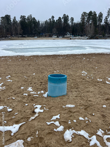 Blue Trash Bin on Winter Lake Beach, Voditsa Forest Ukraine