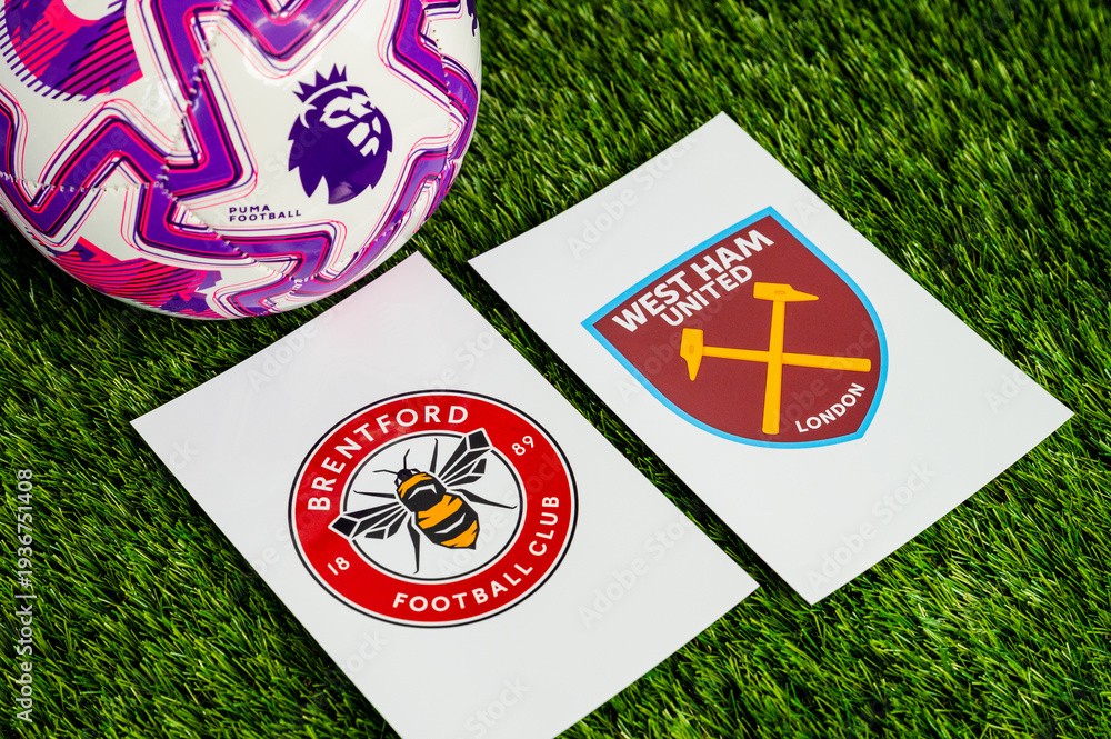 Fototapeta premium Brentford vs. West Ham United English Premier League matchup, team logos and football ball on green grass