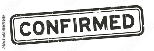 A distressed black stamp boldly displaying the word confirmed in capital letters