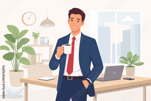 Professional young businessman in a stylish blue suit and red tie standing in a bright modern office, holding a white coffee cup, smiling during a short break with desk, laptop, and plants.