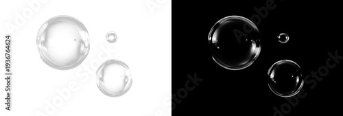 Tablou pe pânză Three transparent soap bubbles of different sizes with soft white reflections on split background