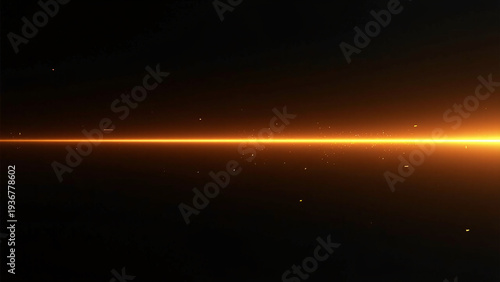 A bright horizontal orange beam cuts across deep darkness, its concentrated center fading outward as tiny glowing particles drift around the radiant line.
