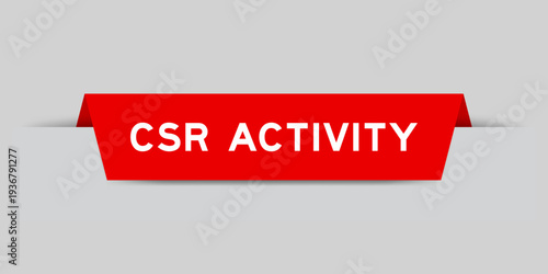 Red color inserted label with word CSR (Abbreviation of corporate social responsibility) activity on gray background