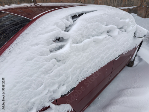 Obraz na plátně Fragment of side and back part parked snowbound red car