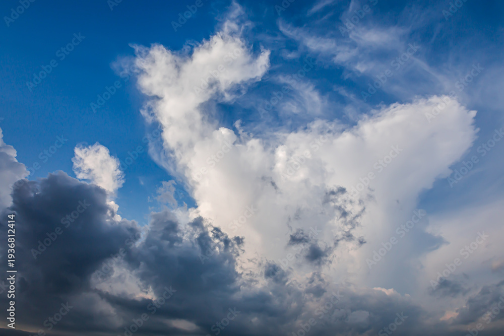 Fototapeta premium Blue sky with cumulus, storm and cirrus clouds before sunset