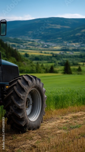 Wallpaper Mural Upward Shot of Tractor Tire on Dirt with Lush Green Landscape in Background Torontodigital.ca