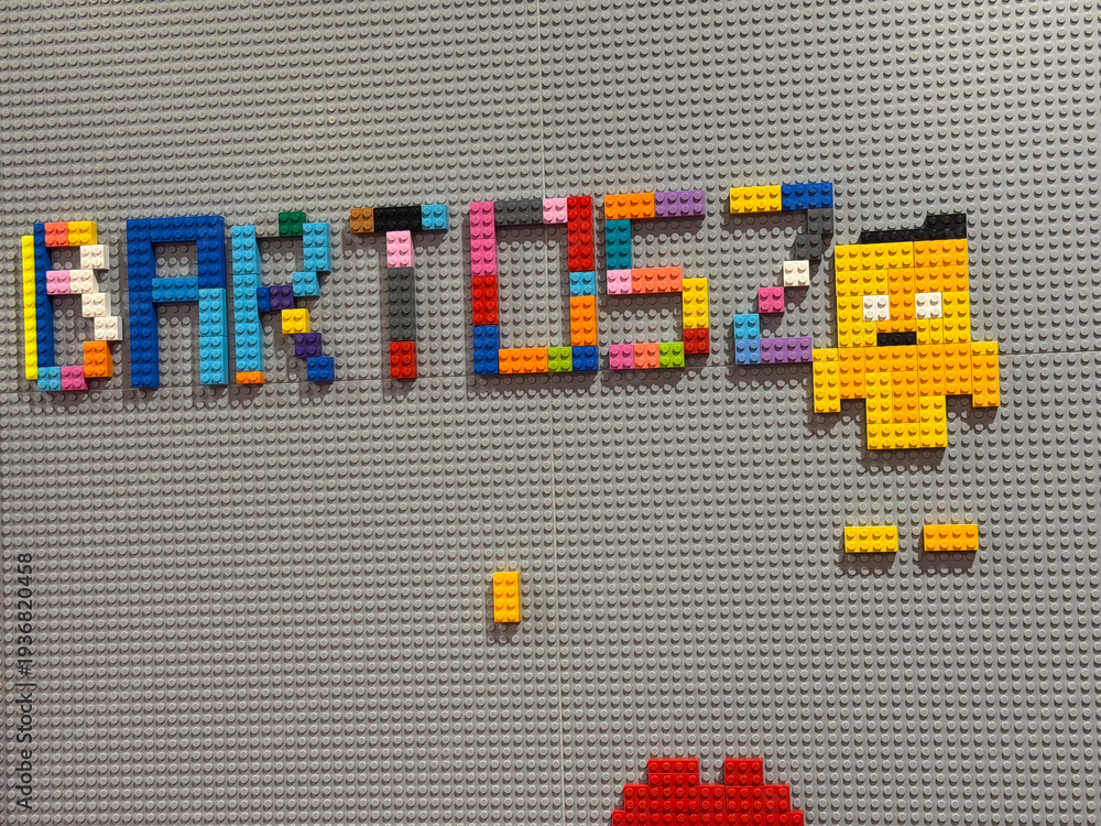 Fototapeta premium Colorful lego lettering and pixel character