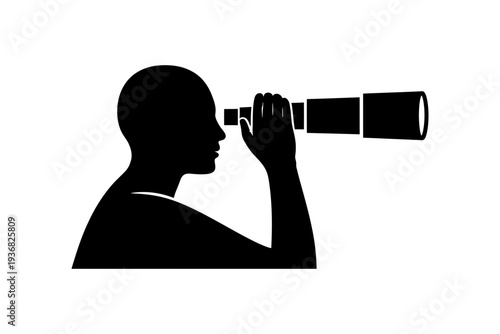 A silhouette of a man looking through a telescope at sunset