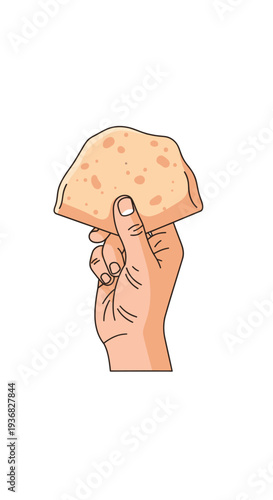 Hand holding a piece of bread.