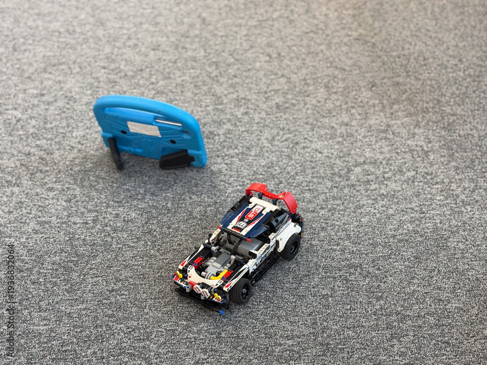 Fototapeta premium Lego-style race car on carpet