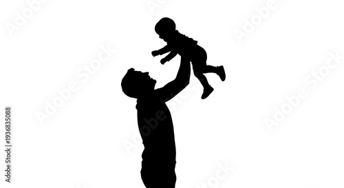 Father throwing happy baby in the air silhouette