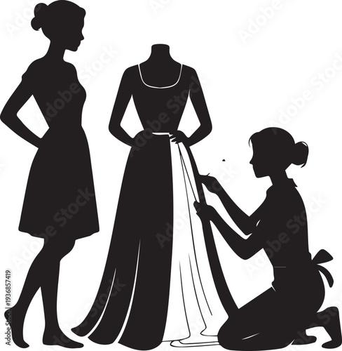 Dressmaker fitting long gown on mannequin near woman standing aside