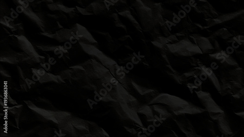 Crumpled texture of black paper background