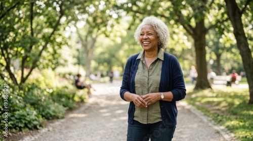 Joyful senior woman laughing in summer park