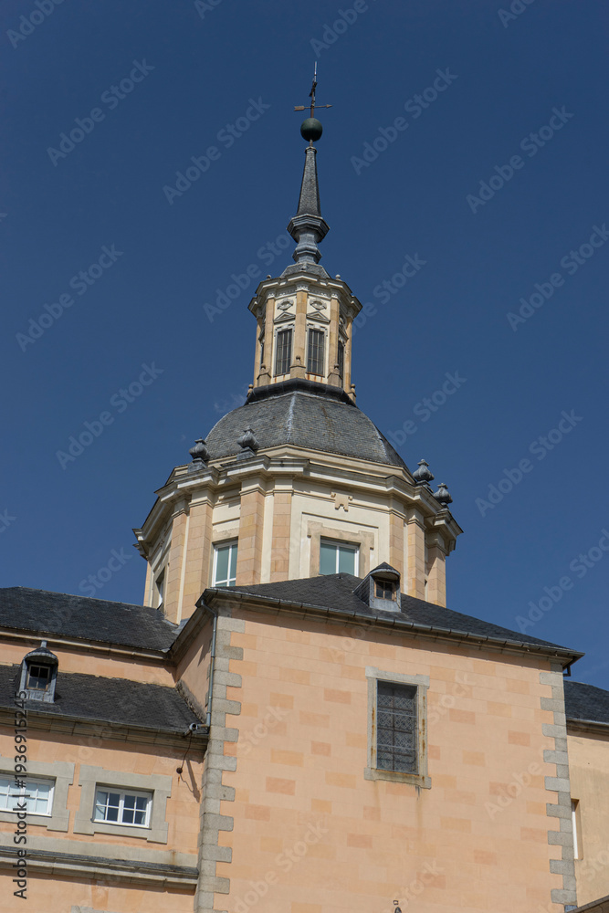 Fototapeta premium Tower of a historic building against a clear sky.. Royal Palace of La Granja de San Ildefonso, Spain