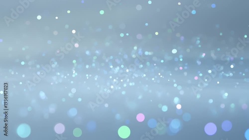 Abstract Bokeh Lights Floating and Sparking Gently on a Soft Blue Background, Slow Motion