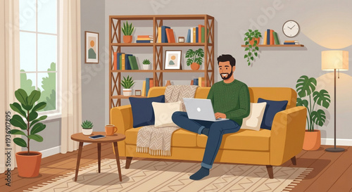 young man sitting on a sofa with a laptop