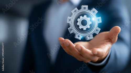 Wallpaper Mural Closeup of faceless businessman's hand presenting glowing gear mechanism, digital network teamwork engineering, operational excellence representing, collaborative technology Torontodigital.ca