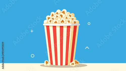Large striped red and white popcorn bucket filled to the brim with yellow buttery popcorn against a blue background for cinema snack themes.