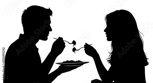 Silhouette of a couple sharing a romantic meal, feeding each other with forks from a single plate.