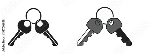 A set of four house keys on two keychains