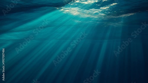 Sunlight Illuminated Underwater Scene Showcasing Serenity, Water Depth, and Calm Blue Oceanic View from Beneath