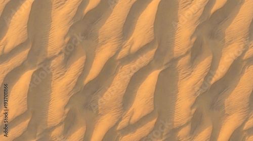 Aerial golden desert sand dunes showing natural wind ripples for luxury travel backgrounds and environmental web designs