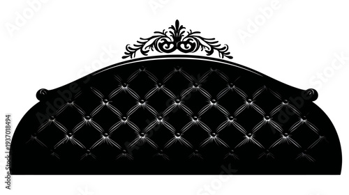 A regal, tufted, black headboard with a decorative crest. Luxurious design. Monochromatic, elegant