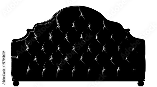 A classic, ornate headboard in black, with button tufting detail. Rounded top and ball feet