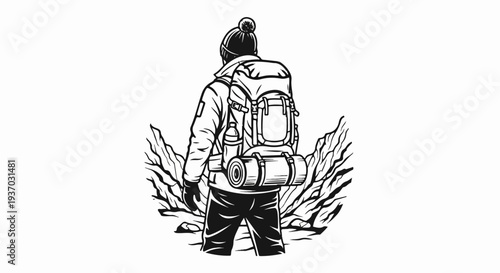 Hiker in winter gear with backpack stands against rugged terrain
