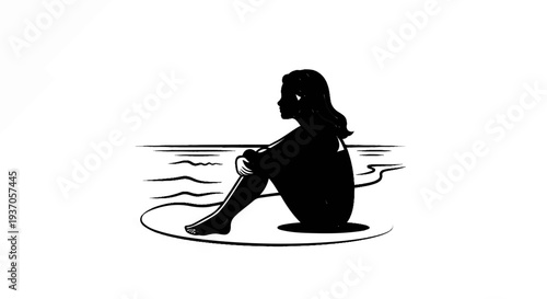 Silhouette of a contemplative person sitting by the ocean