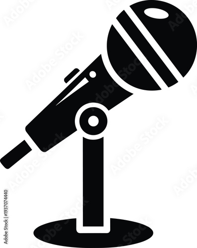 Black silhouette icon of a professional vocal microphone on a short desk stand isolated on a white background for design.