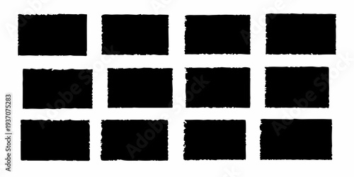 Arrangement of nine black rectangular torn paper shapes on white