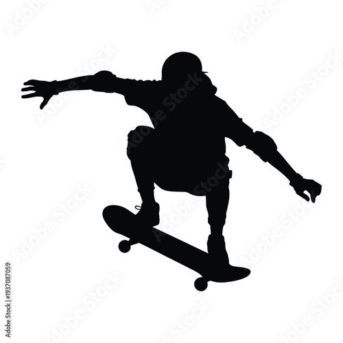 Silhouette of a skateboarder performing a trick in mid air