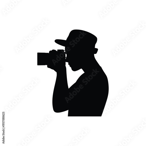Silhouette of a photographer taking a picture with a camera