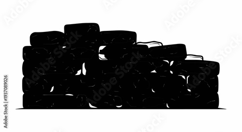 Stack of black, irregular shapes resembling coal or rock piles