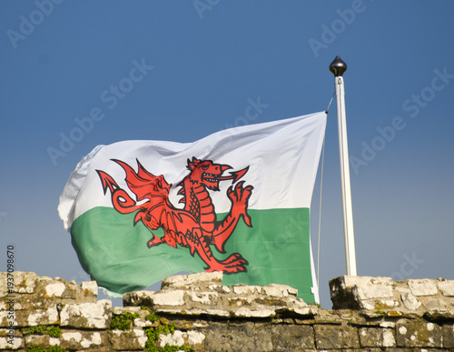 Welsh Flag Waving in Wind with Red Dragon Symbol over Green and White Background, Wales, UK