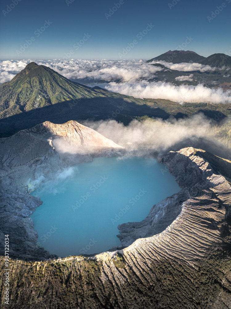 Fototapeta premium A stunning aerial view of the Kawah Ijen volcano crater tranquil scenery of a blue lake in the mountains