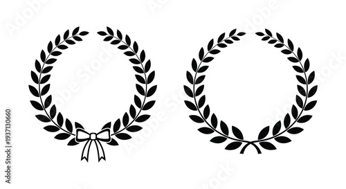 Two black laurel wreaths with a ribbon bow one including a decorative ribbon at the bottom
