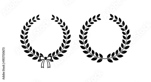 Two black laurel wreaths one with a ribbon displayed against a plain white background high quality