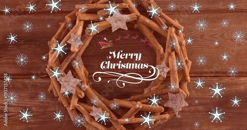 On scene load wreath animating with floating stars and drifting snowflakes for holiday card design