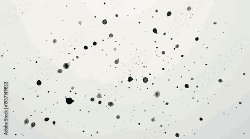 Black speckles scattered on a white background, creating a minimalist design.