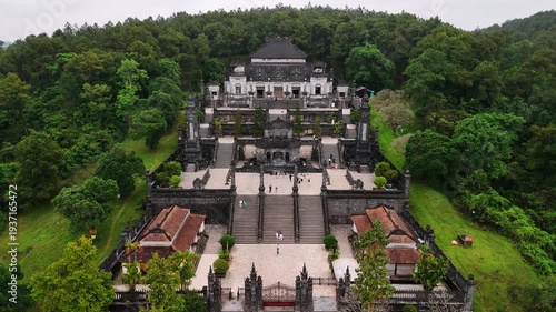Imperial khai dinh tomb in hue, vietnam, with tourists exploring the historic royal mausoleum from an aerial view