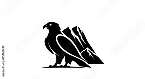 Eagle perched on mountain crest silhouette