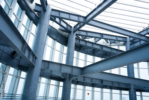 Interior view of modern steel structure building with exposed beams and columns