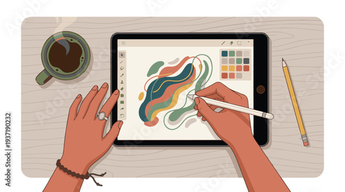 Digital artist's hands drawing abstract shapes on a tablet with stylus, coffee