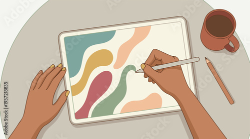 Overhead view of hands creating colorful abstract design on digital tablet